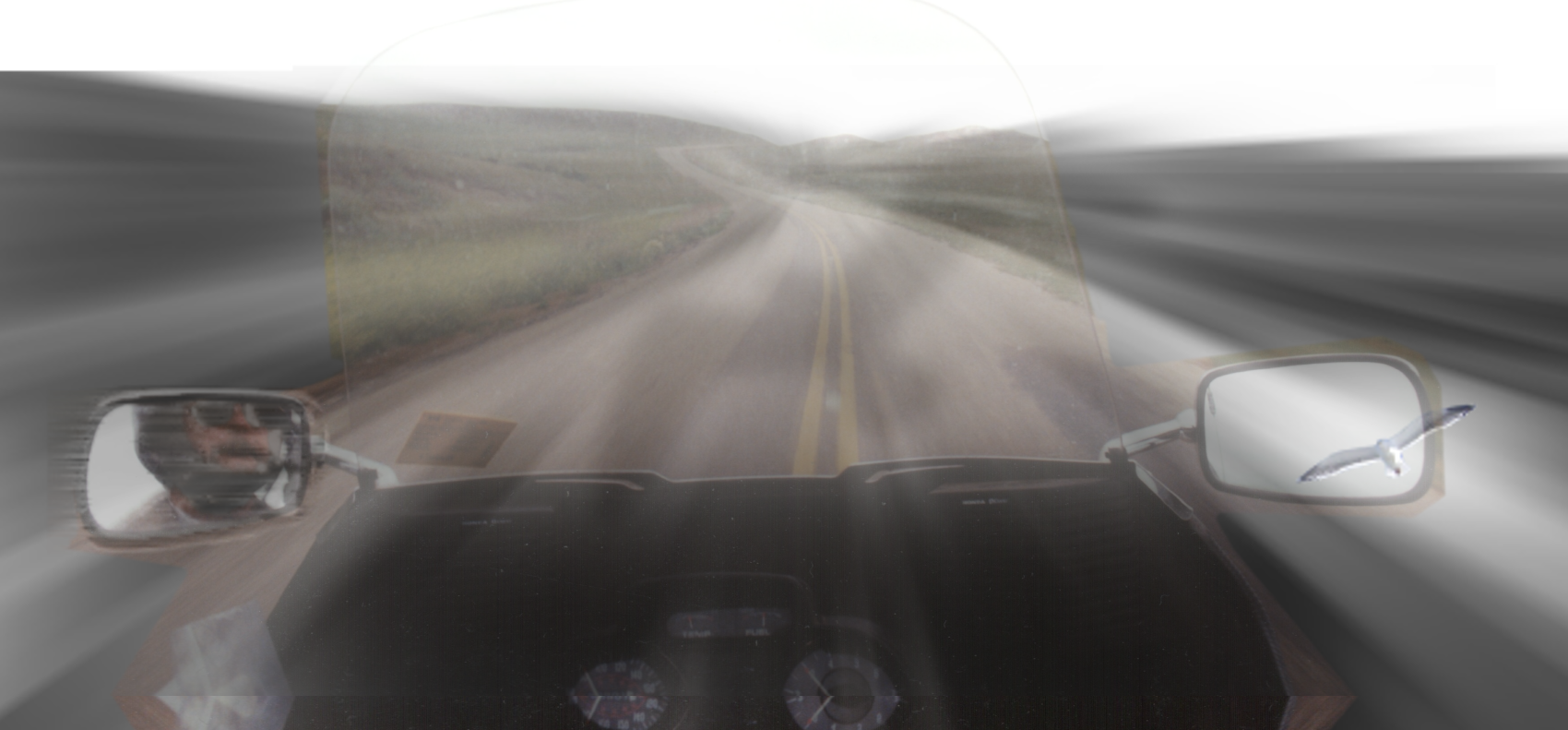 image showing a motorcyle rider's point of view traveling across the prairies