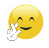 image of smiley emoji with crossed fingers.